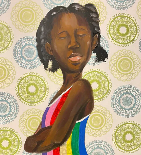 portrait of a little black girl wearing a colorful rainbow top